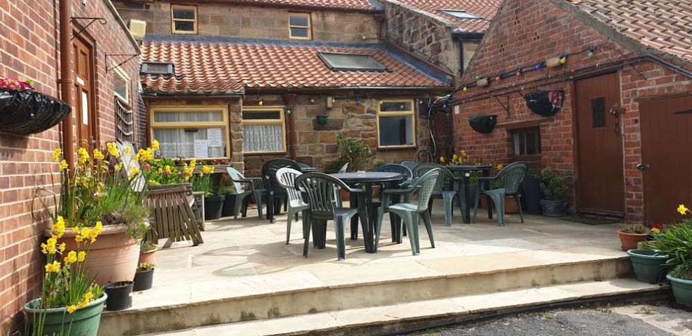 picture of the outside seating area at the rear of the Fox & hounds
